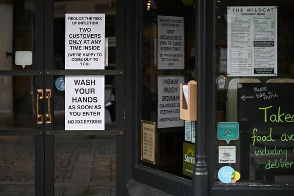 Signs in a coffee shop in Main Street Fort William as people are asked to stop travelling to the Scottish Highlands in a bid to avoid spreading the coronavirus (Photo: Jeff J Mitchell/Getty Images)