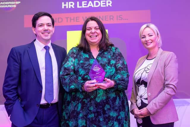 Heidi Thompson (centre) receives her accolade at the East Midlands Leadership Awards, hosted by TheBusinessDesk.com
