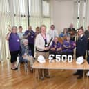Singing &amp; Sound, a Stroke Association group, pictured with Taylor Wimpey Site Manager Ruth Pollard