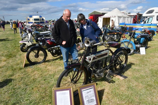 David and Rose Mayfield, of Newark, inspect one of the vintage bikes at the rally.