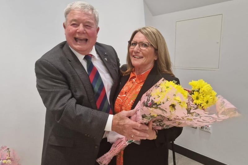 Outgoing Mayor Coun Pete Barry presents a bouquet to his chaplain for the year,  St Matthew's Reader Jean Smith.