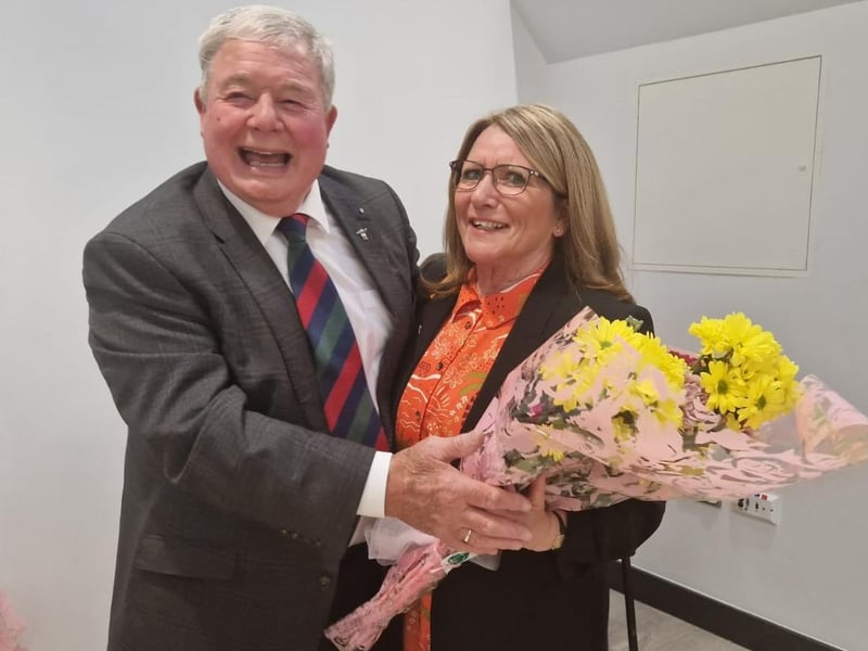 Outgoing Mayor Coun Pete Barry presents a bouquet to his chaplain for the year, St Matthew's Reader Jean Smith.
