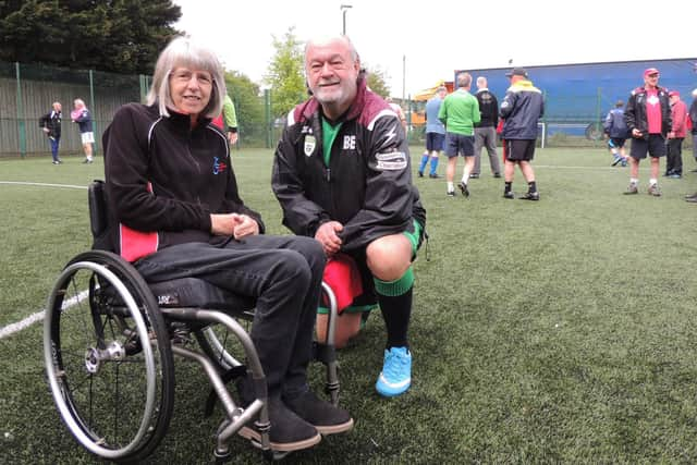 Thelma Smith of Sleaford Laffletics with Sleaford Snails treasurer Bill Eaton.