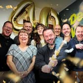 Managing Director, Ian Croney, and Director James McWilliam celebrate with the DW team