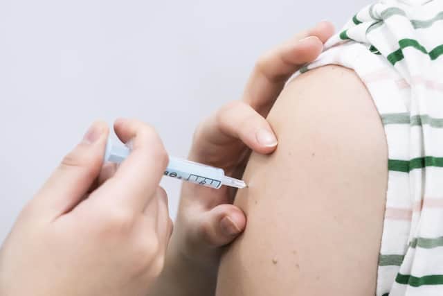 File photo dated 21/12/21 of a booster coronavirus vaccine being administered, as the NHS has visited every care home in England to deliver coronavirus booster and flu jabs, it has said.