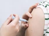 File photo dated 21/12/21 of a booster coronavirus vaccine being administered, as the NHS has visited every care home in England to deliver coronavirus booster and flu jabs, it has said.