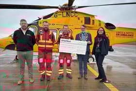 Joe Harper, Dr Paul Hancock, Matt Burns, Coun Stephen Bunney and Deborah Balsdon are pictured at the cheque presentation to Lincolnshire Air Ambulance