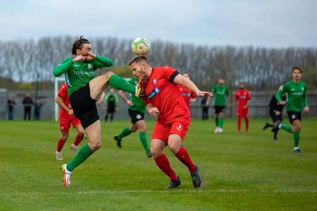 Action from Sleaford Town's battle with Heanor.