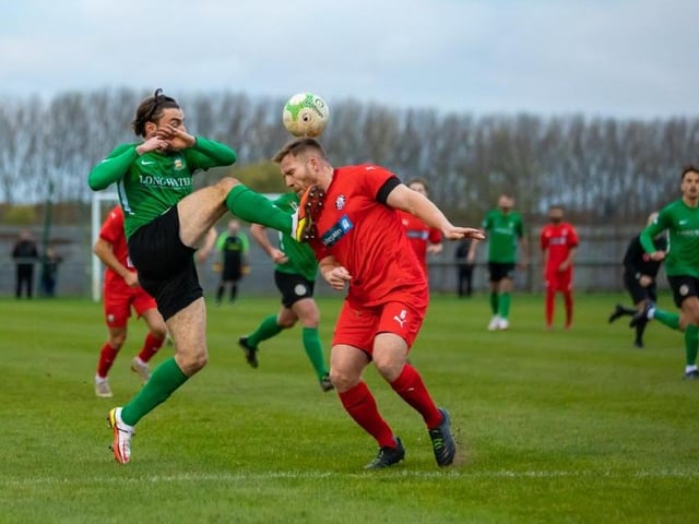 Action from Sleaford Town's battle with Heanor.