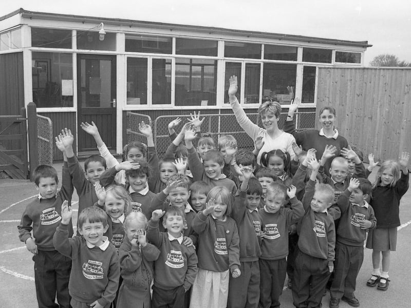 Pupils from Frithville Primary School waving goodbye to their old classroom. The school had been successful in a bid to the Department for Education and Employment to turn a temporary, mobile classroom into a permanent building. The mobile, which was more than 30 years old, was expected to be replaced by April 2001.