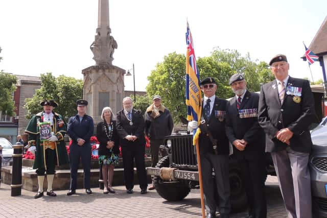 The Mayor Coun David Suiter and Deputy Mayor Coun Alison Snookes join Town Crier John Griffiths and Royal British Legion members in Sleaford to honour the D-Day 80th anniversary in the Market Place.
