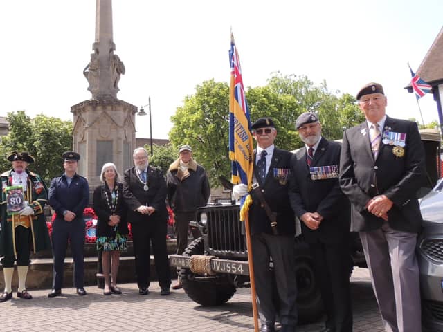 The Mayor Coun David Suiter and Deputy Mayor Coun Alison Snookes join Town Crier John Griffiths and Royal British Legion members in Sleaford to honour the D-Day 80th anniversary in the Market Place.