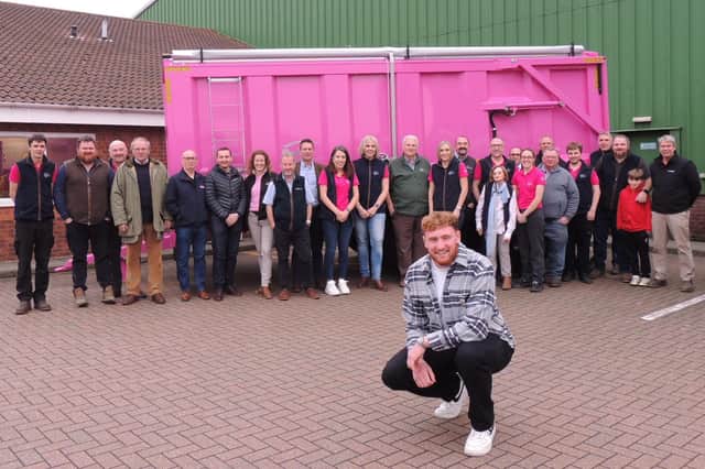 ​Rugby star Ollie Chessum, Bailey Trailers staff, dealers, suppliers and invited guests with the pink trailer that was raffled off.