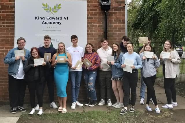 King Edward V1 Academy students in Spilsby celebrating their A-Level results. Pictured are (from left) Deale Fisher, Ella Hopkins, Thomas Corns, Megan Blanchard, Logan Redford, Bethan Simpson, Reece Parry, Abbie Holloway, Mason Barnes,  Jessica Holloway, Jude Bache , Anya Dennis and Jaime-Lee Ashburn