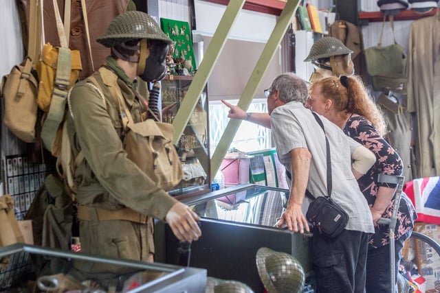 Visitors look at the many war-time exhibits in the museum.