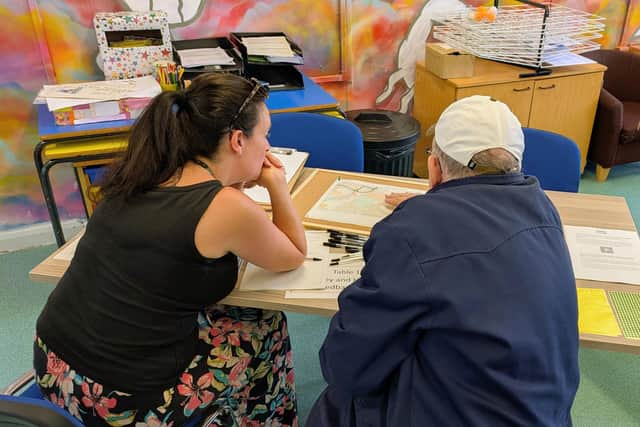 A member of the Safer Lincolnshire Partnership talks to a resident about their concerns.