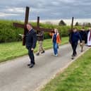 The procession of three crosses up to Red Hill on Good Friday morning.