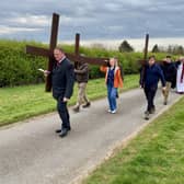 The procession of three crosses up to Red Hill on Good Friday morning.