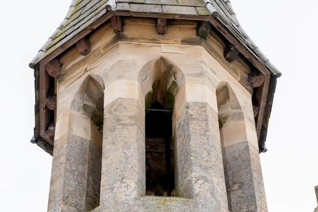 The cemetery chapel spire.