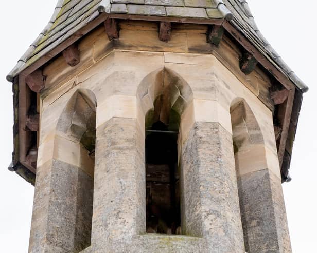The cemetery chapel spire.