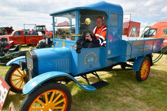 Malcolm Hodson of RH Crawford and Sons, in Frithville, sitting in a 1920 Ford Model T truck.