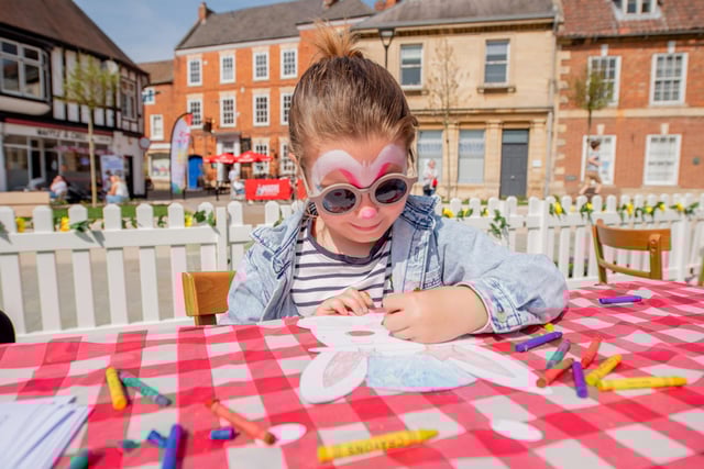 Tyler Green decorates her Easter mask. Photo: John Aron