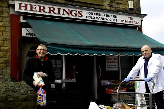 David, left, and Steven Herring outside their shop in Mosborough getting together one of the food boxes that have been paid for from a donation by Harry Maguire the former Sheffield United defender.