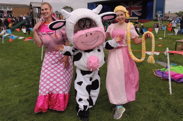 BADass amateur theatre group members, from left - Tobias Downs, Iana Thewliss and Al Casement, in costume for their performance on stage at the Billinghay jubilee fun day.