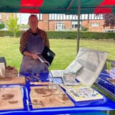 Ceramic artist Shaun Clark helped visitors create small clay tiles, decorated with nature themes