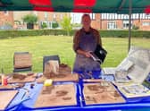 Ceramic artist Shaun Clark helped visitors create small clay tiles, decorated with nature themes