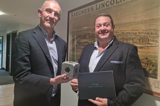 Steve Wright and Richard Arnold of R Arnold Funeral Services with a small plastic model of one of the blocks.