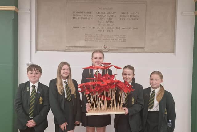 Students with their poppies  (from left) are Jude Ellis, 12, Ava Bell, 12, Paige Wiles, 12, Harlow Mclean, 12, amd Amelia Wynn, 11.