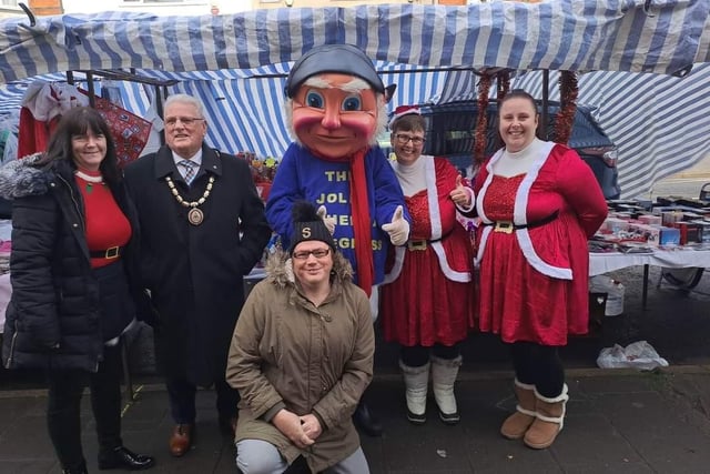 Mayor of Skegness Coun Tony Tye, Carnival Royalty and the Jolly Fisherman at Skegness Christmas market.
