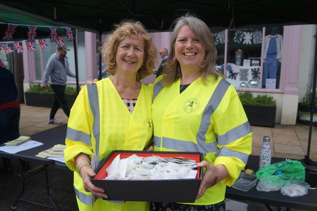 Jayne Bowman and Sally Allison with some of the commemorative seeds being given away for the coronation