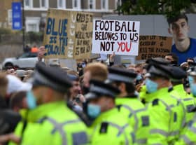 Police line up as Chelsea fans protest against the newly proposed European Super League prior to the Premier League match between Chelsea and Brighton & Hove Albion at Stamford Bridge. (Photo by Mike Hewitt/Getty Images)