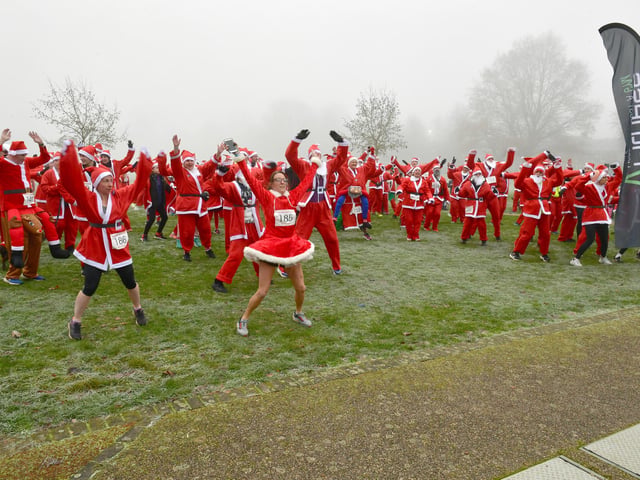 VFitness giving the Santas a warm-up session ahead of the run.