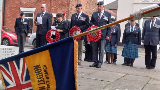 The Standard is lowered as the Last Post sounds