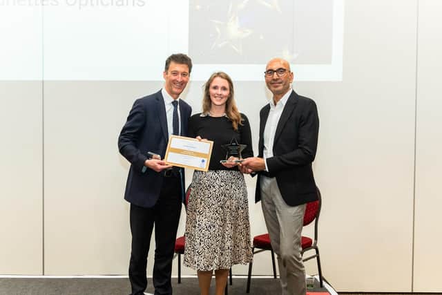 (L-R) Laura Trope and Tushar Majithia being presented with the Optometry Team of the Year Award.