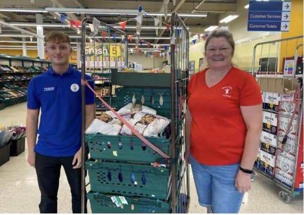 Tesco staff member Kai and Sally from Market Rasen Preschool Nursery