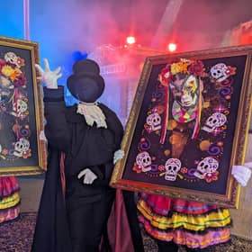 Three of the walkaround performers entertaining crowds inbetween the scare zones.