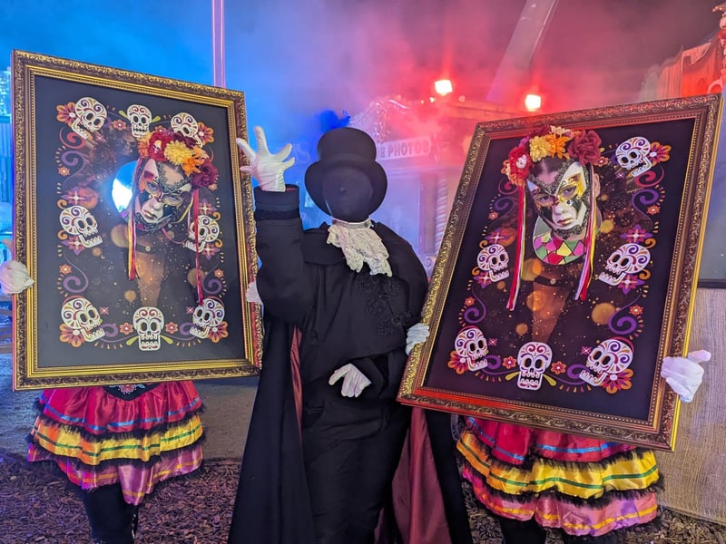 Three of the walkaround performers entertaining crowds inbetween the scare zones.
