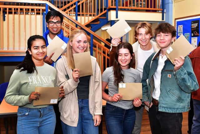 QEGS students receive their A Level results, from left: Lavdhi Jain, Saha Jansari Aakasu, Freya Hadley, Emily Byron, Jamie Sykes, and Ben Stainsby. Photos: Mick Fox