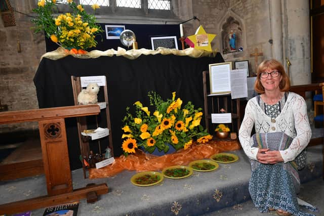 Christine Newitt with her floral display at Great Hale Church.