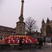 Air Cadets stand on ceremony around the memorial, surrounded by the ongoing works to revamp the Market Place.