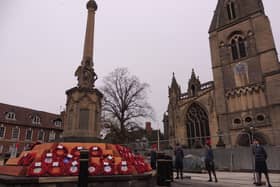 Air Cadets stand on ceremony around the memorial, surrounded by the ongoing works to revamp the Market Place.