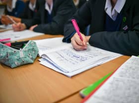 Students write in their exercise books in class at Royal High School Bath, which is a day and boarding school for girls aged 3-18 and also part of The Girls' Day School Trust, the leading network of independent girls' schools in the UK. 