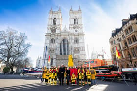 RNLI Chair Janet Cooper and RNLI Chief Executive Mark Dowie outside Westminster Abbey with RNLI lifeboat crew and lifeguards. RNLI/Nathan Williams