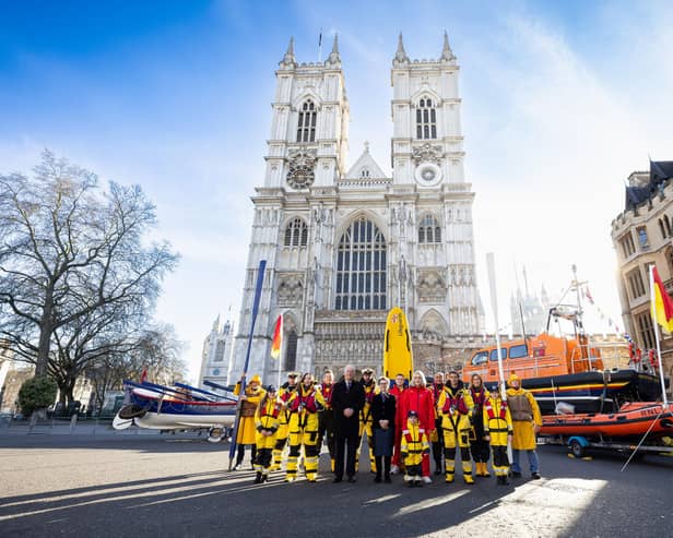 RNLI Chair Janet Cooper and RNLI Chief Executive Mark Dowie outside Westminster Abbey with RNLI lifeboat crew and lifeguards. RNLI/Nathan Williams