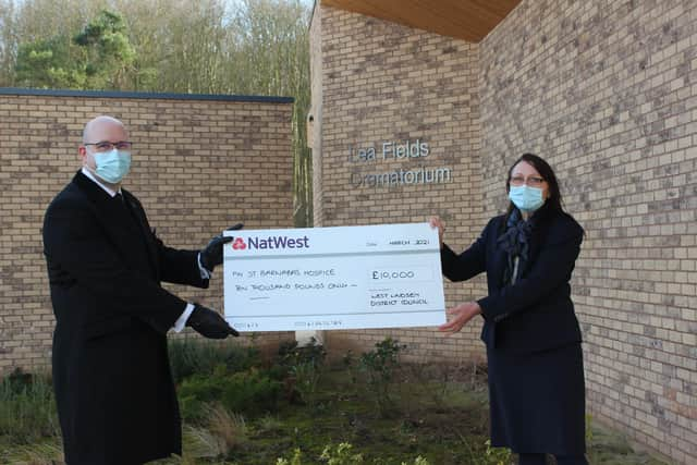 Carlton Bradley and Deborah Balsdon with the cheque