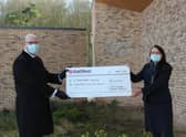 Carlton Bradley and Deborah Balsdon with the cheque